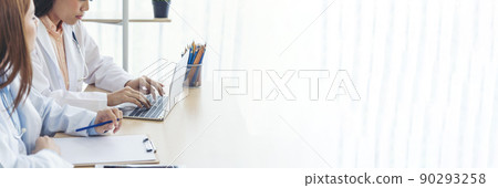 Banner hands of two women doctor medical lab discussing together healthcare teamwork. Panorama Two asian women doctors meeting write prescription medical clinic office using laptop with copy space. Banner hands of two women doctor medical lab discussing together healthcare teamwork. Panorama Two asian women doctors meeting write prescription medical clinic office using laptop with copy space. 90293258