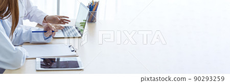 Banner hands of two women doctor medical lab discussing together healthcare teamwork. Panorama Two asian women doctors meeting write prescription medical clinic office using laptop with copy space. Banner hands of two women doctor medical lab discussing together healthcare teamwork. Panorama Two asian women doctors meeting write prescription medical clinic office using laptop with copy space. 90293259
