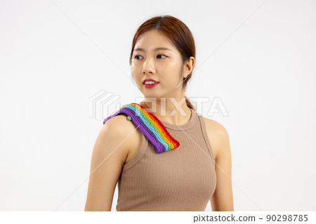 Studio portrait of a asian woman over isolated white background. LGBT pride month concept Studio portrait of a asian woman over isolated white background. LGBT pride month concept 90298785
