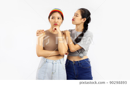 Photo of Young asian women in concept of lgbt couple isolated on white wall background. 90298893