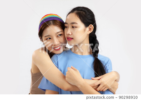 Young asian women in concept of lgbt couple isolated on white background. love pride month concept Young asian women in concept of lgbt couple isolated on white background. love pride month concept 90298910