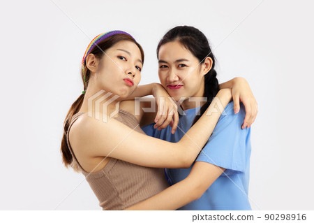 concept of lgbt couple, Two asian women isolated on white background. love pride month 90298916