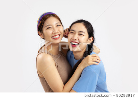 Two Happy asian women in concept of lgbt couple isolated on white background. love pride month Two Happy asian women in concept of lgbt couple isolated on white background. love pride month 90298917