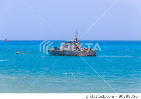 Warship anchored in the Indian ocean near Zanzibar, Tanzania Warship anchored in the Indian ocean near Zanzibar, Tanzania 90299350
