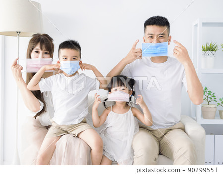 Happy asian family wearing medical mask and stay Happy asian family wearing medical mask and stay 90299551