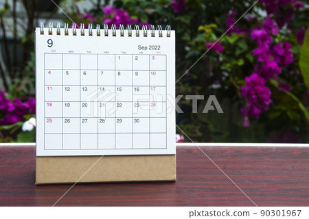 September 2022 white calendar with blurred nature background. Copy space September 2022 white calendar with blurred nature background. Copy space 90301967
