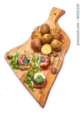 Portion of delicious chicken aspic on serving board isolated on white background Portion of delicious chicken aspic on serving board isolated on white background 90302100