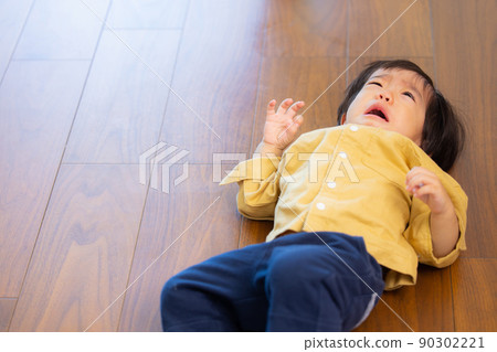 A boy who is crying 90302221