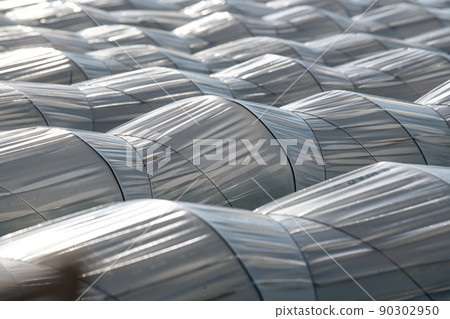 Farm plantation covered under agricultural plastic film tunnel rows, Create a greenhouse effect Farm plantation covered under agricultural plastic film tunnel rows, Create a greenhouse effect 90302950