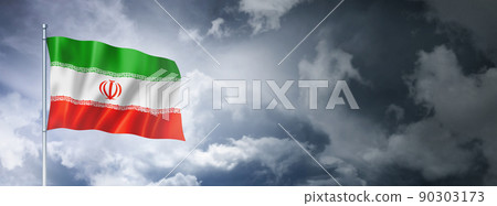 Iranian flag on a cloudy sky 90303173