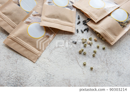Microgreen seeds in paper bags and equipment for sowing microgreens. 90303214