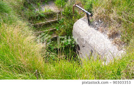 Entrance to an old bunker from WW2 90303353