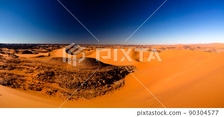 Sunset view to Tin Merzouga dune at Tassili nAjjer national park in Algeria 90304577