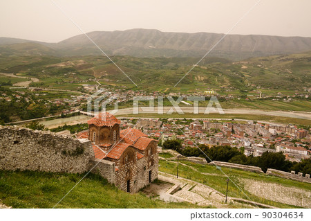 Panoramic aerial view to Berat old town and Osum river and Holy Trinity Church from Berat Castle , Albania Panoramic aerial view to Berat old town and Osum river and Holy Trinity Church from Berat Castle , Albania 90304634