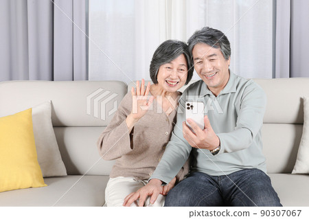 Asian Korean Family_An elderly couple having a video call Asian Korean Family_An elderly couple having a video call 90307067