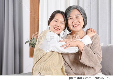Asian Korean family_Grandmother and grandchild hugging Asian Korean family_Grandmother and grandchild hugging 90307069