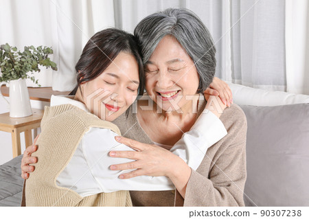 Asian Korean family_Grandmother and grandchild hugging Asian Korean family_Grandmother and grandchild hugging 90307238