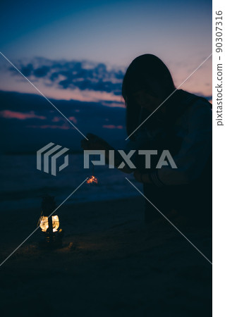 The silhouette of a high school girl in uniform and the beautiful sunset sky The silhouette of a high school girl in uniform and the beautiful sunset sky 90307316