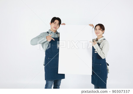 start up concept asian korean young woman and man holding a panel start up concept asian korean young woman and man holding a panel 90307337