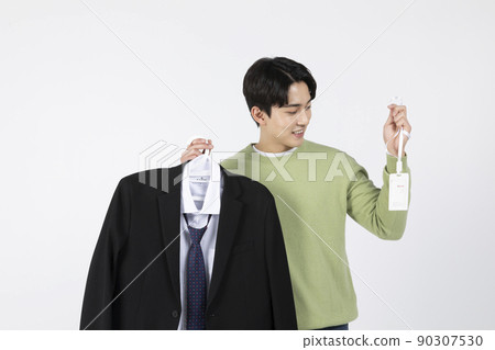 job interview_ asian korean young man in suit and employee ID preparing for interview job interview_ asian korean young man in suit and employee ID preparing for interview 90307530