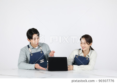 Asian Korean young man and woman startup concept_ doing hand gestures Asian Korean young man and woman startup concept_ doing hand gestures 90307776