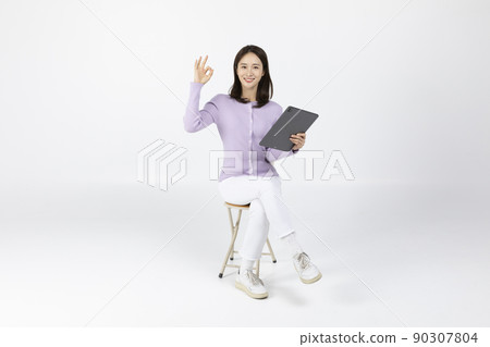 job interview_ asian korean young man holding a tablet pc and gesturing ok job interview_ asian korean young man holding a tablet pc and gesturing ok 90307804