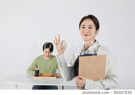 Asian Korean young man and woman startup concept_Ok the president doing hand gestures 90307830