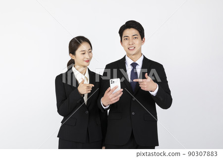 Asian Korean young generations woman and man job interview concept_Hand gestures while holding smartphones Asian Korean young generations woman and man job interview concept_Hand gestures while holding smartphones 90307883