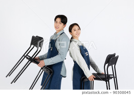 Asian Korean young man and woman startup concept_ tidying up their chairs 90308045