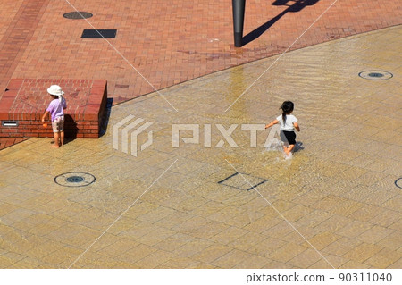Children playing in the water Children playing in the water 90311040