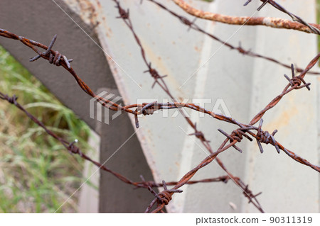 Detail hedgehod anti-tank barrier with barbed wire Detail hedgehod anti-tank barrier with barbed wire 90311319