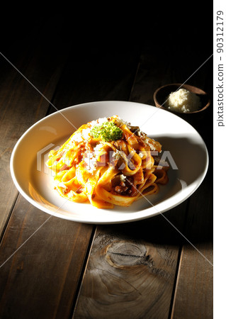 Bolognese with flat pasta fitcine and tomato sauce and parmesan cheese 90312179