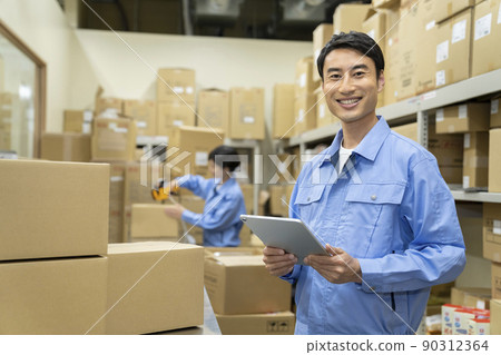 Image of middle-aged men working in a warehouse for inventory management Image of middle-aged men working in a warehouse for inventory management 90312364