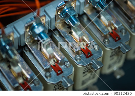 Centred tag fuse in electrical circuit installation close-up 90312420