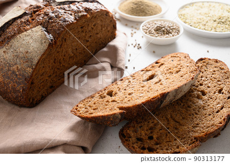 Hemp bread and hemp seeds on white background. Hemp bread and hemp seeds on white background. 90313177