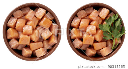 Salmon cut into cubes in a bowl 90313265