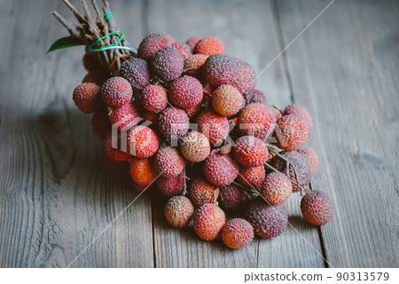 Lychee fruit on wooden background, fresh ripe lychee peeled from lychee tree at tropical fruit Thailand in summer 90313579
