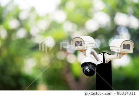 cctv on black pole,360-degree CCTV system, technology, 8k system that is careful, takes care of people, is safe 24 hours on the background. cctv on black pole,360-degree CCTV system, technology, 8k system that is careful, takes care of people, is safe 24 hours on the background. 90314311