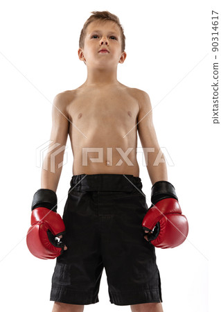 Closeup portrait of little boy, kid in sports shots and gloves posing on white studio background. Sport, education, action, motion concept. Closeup portrait of little boy, kid in sports shots and gloves posing on white studio background. Sport, education, action, motion concept. 90314617