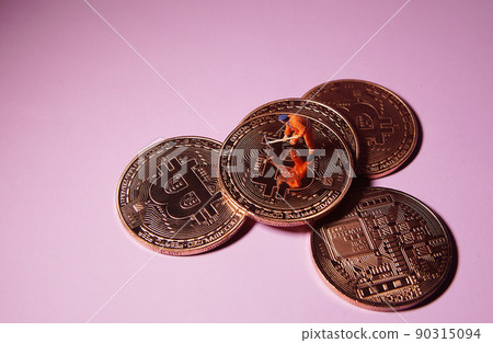 Technician worker figure standing on bitcoin. Bitcoin mining concept. 90315094