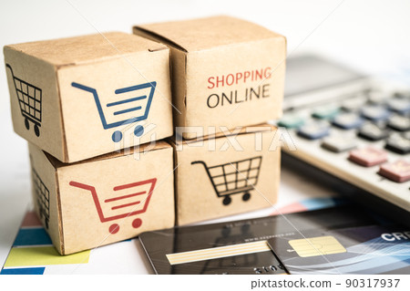 Shopping online box with credit card and calculator on graph. Finance commerce import export business concept. 90317937