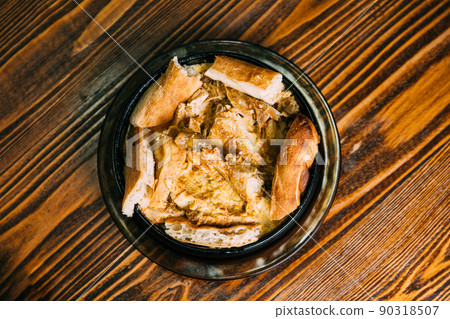 Chkmeruli or Shkmeruli is a traditional Georgian dish of chicken in garlic sauce. Georgian cuisine. flat view Chkmeruli or Shkmeruli is a traditional Georgian dish of chicken in garlic sauce. Georgian cuisine. flat view 90318507