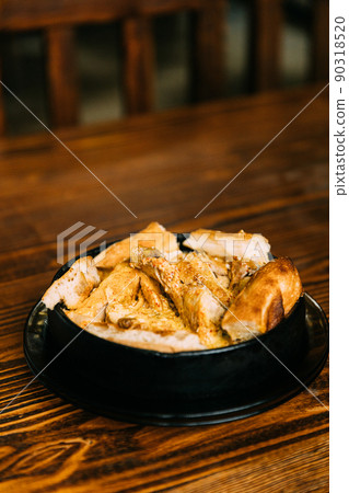 Chkmeruli or Shkmeruli is a traditional Georgian dish of chicken in garlic sauce. Georgian cuisine. Chkmeruli or Shkmeruli is a traditional Georgian dish of chicken in garlic sauce. Georgian cuisine 90318520