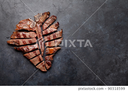Grilled porterhouse beef steak. Sliced T-bone 90318599