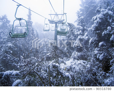 Snowy forest seen from the lift to Longmen Grottoes, Kunming, Yunnan, China Snowy forest seen from the lift to Longmen Grottoes, Kunming, Yunnan, China 90318780