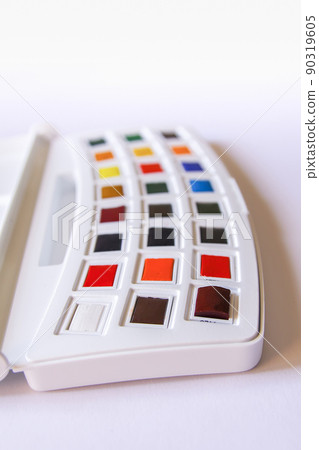 Watercolor paints on white background. Flat lay, top view 90319605