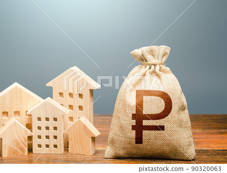 Houses and money bag. Community municipal budget. Investments in real estate and construction industry. Overheated market. Energy efficiency and costs for heating and home services. Houses and money bag. Community municipal budget. Investments in real estate and construction industry. Overheated market. Energy efficiency and costs for heating and home services. 90320063