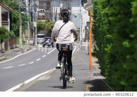 Bicycle on the sidewalk 90320612