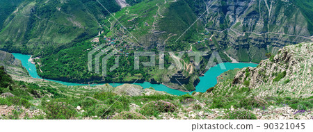 top view of the mountain river Sulak in Dagestan with the village of Old Zubutli with a boat pier top view of the mountain river Sulak in Dagestan with the village of Old Zubutli with a boat pier 90321045