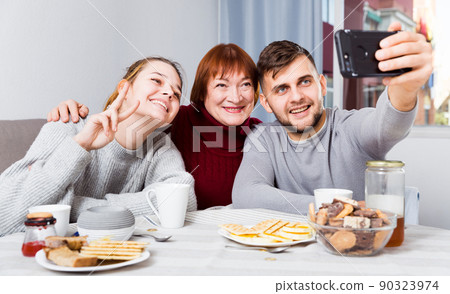 Cheerful family taking selfie Cheerful family taking selfie 90323974